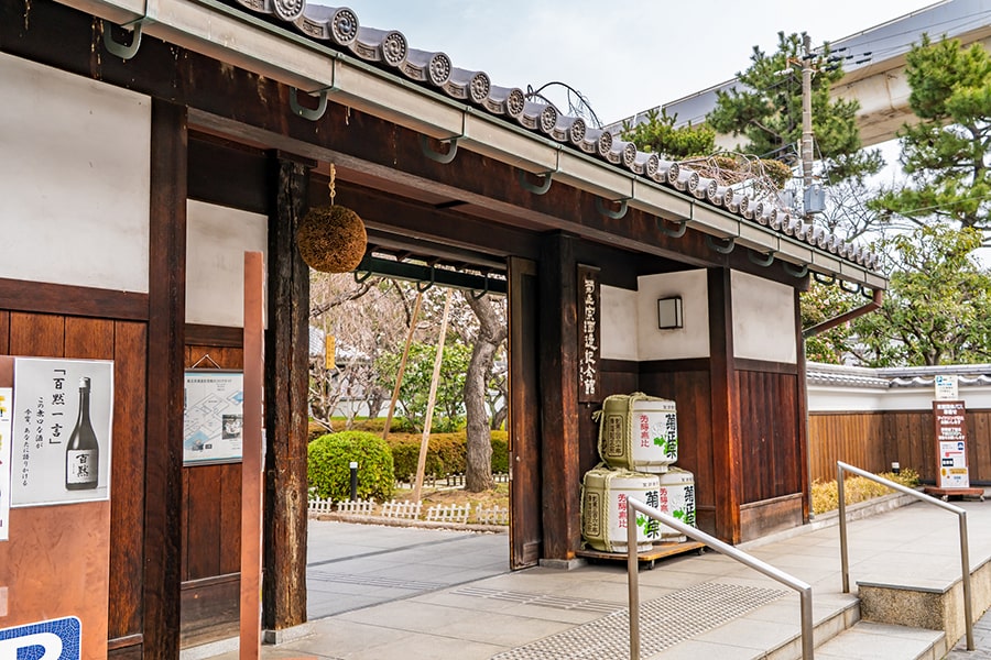 The owner of Yakitori Isao grilling skewers over charcoal at his restaurant